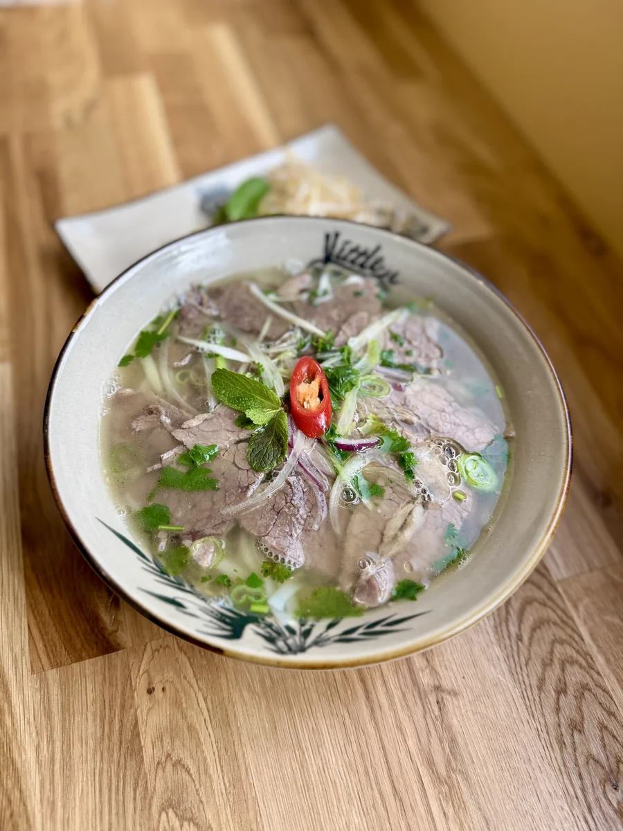 Traditional Vietnamese pho with fresh herbs